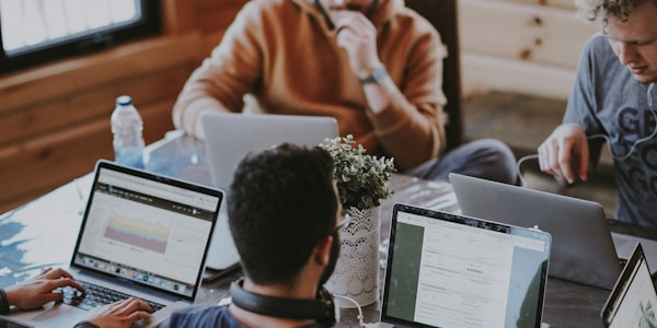 Young professionals collaborating on cybersecurity challenges